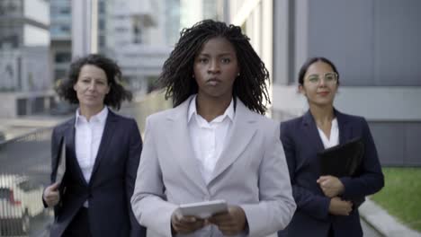 Multiethnic-businesswomen-walking-on-street